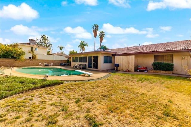 exterior space featuring central AC, a yard, a fenced in pool, and a patio