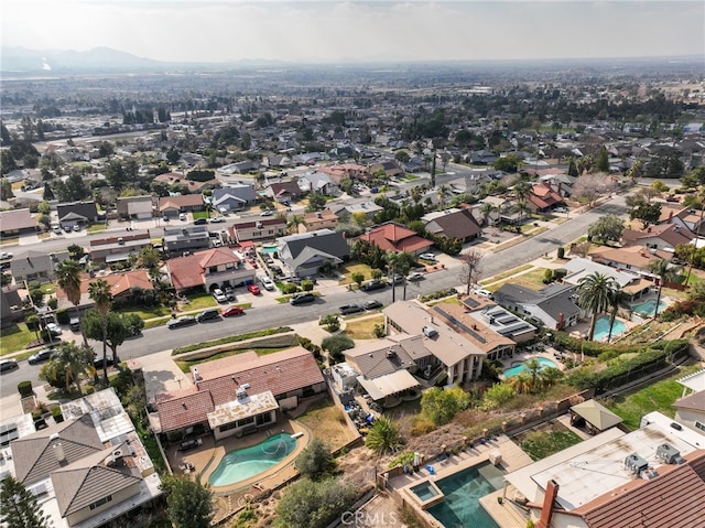 birds eye view of property with a residential view