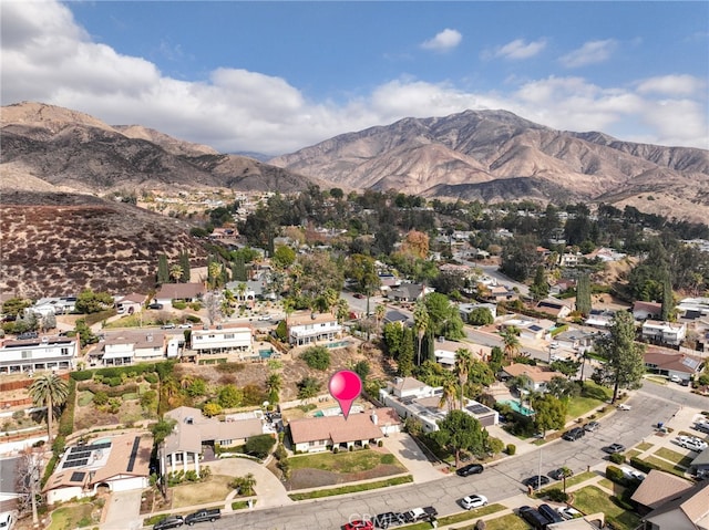 birds eye view of property with a mountain view