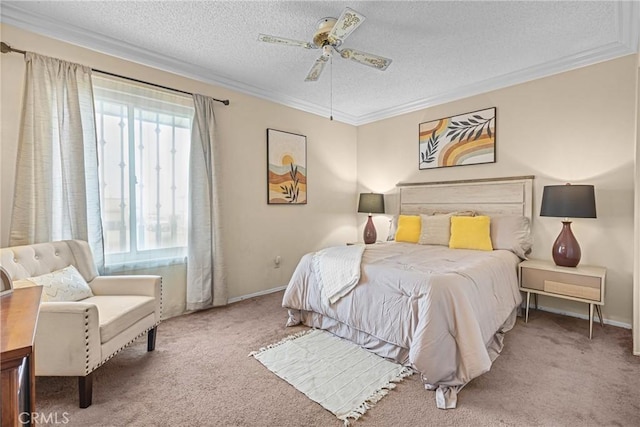 carpeted bedroom featuring a ceiling fan, a textured ceiling, ornamental molding, and baseboards