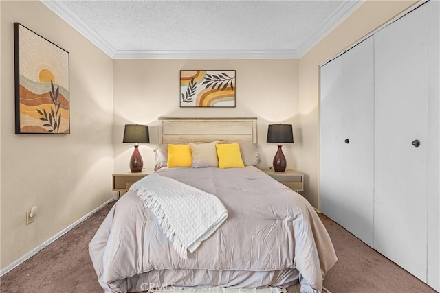 carpeted bedroom with a textured ceiling, ornamental molding, baseboards, and a closet