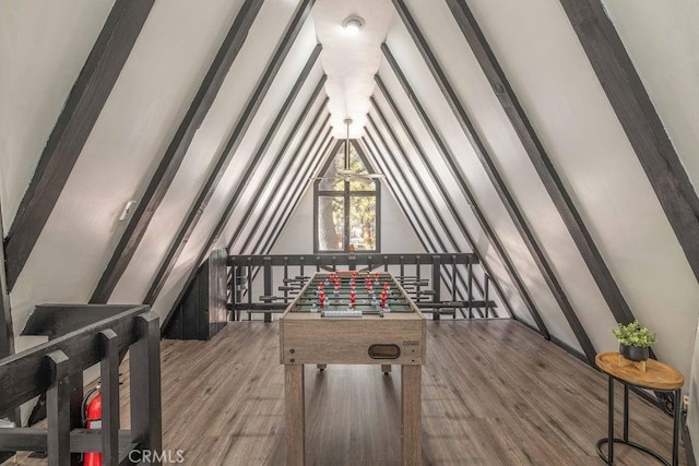 playroom with vaulted ceiling and hardwood / wood-style floors