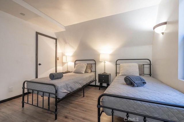 bedroom with wood-type flooring