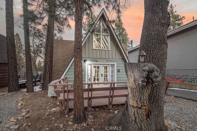 back house at dusk with french doors