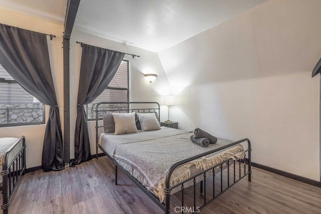 bedroom featuring wood-type flooring