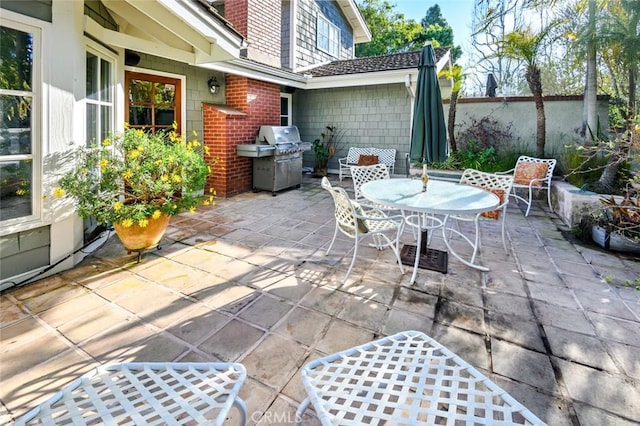 view of patio featuring a grill