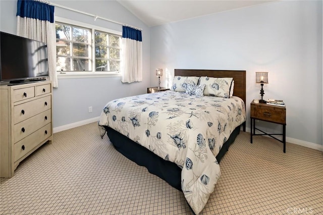 carpeted bedroom featuring lofted ceiling