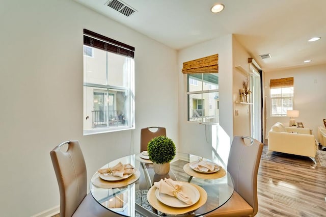 dining area featuring hardwood / wood-style floors