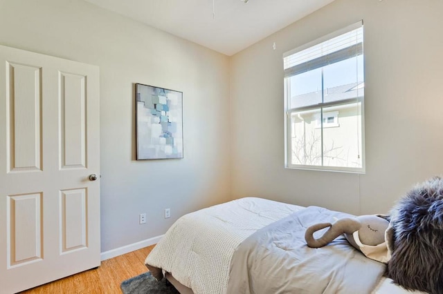 bedroom with light hardwood / wood-style flooring