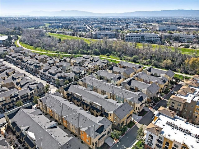 birds eye view of property featuring a mountain view