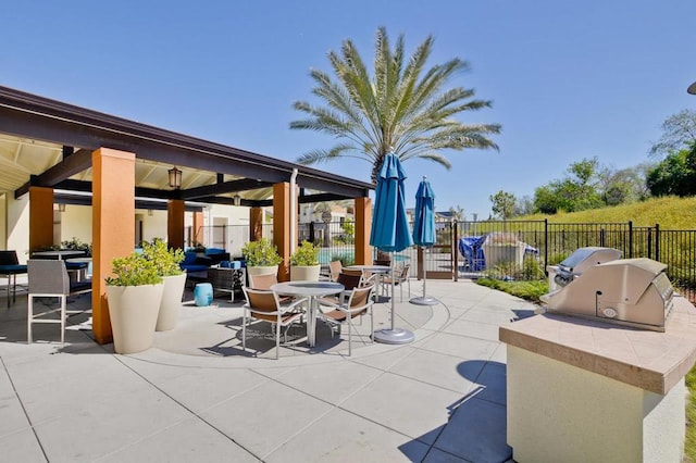 view of patio featuring area for grilling and exterior kitchen