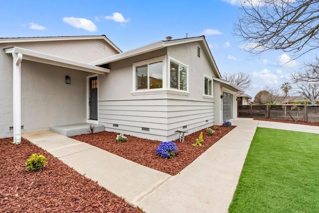 view of front of house with a garage and a front lawn