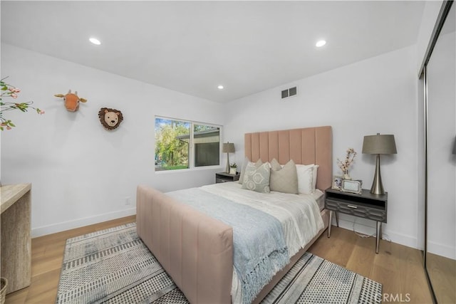 bedroom featuring light wood-type flooring