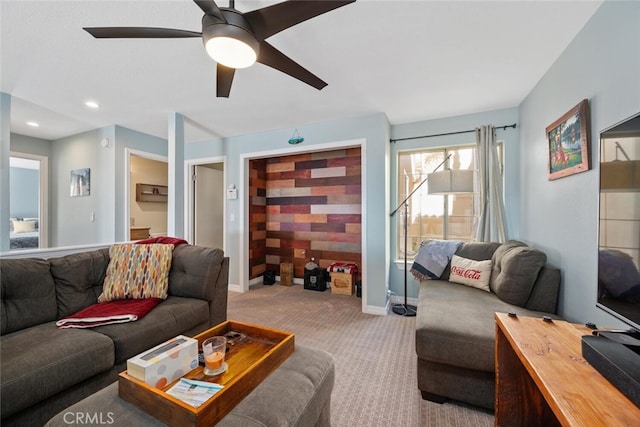 living room with light carpet and ceiling fan