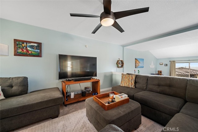 living room with light colored carpet, a textured ceiling, and ceiling fan