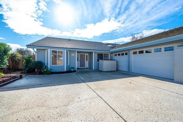 ranch-style home featuring a garage