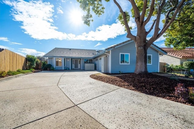 single story home with a garage