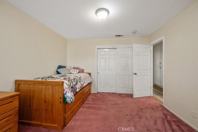 bedroom with carpet floors and a closet