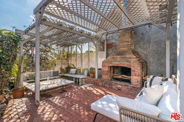 view of patio / terrace featuring a pergola and an outdoor living space with a fireplace