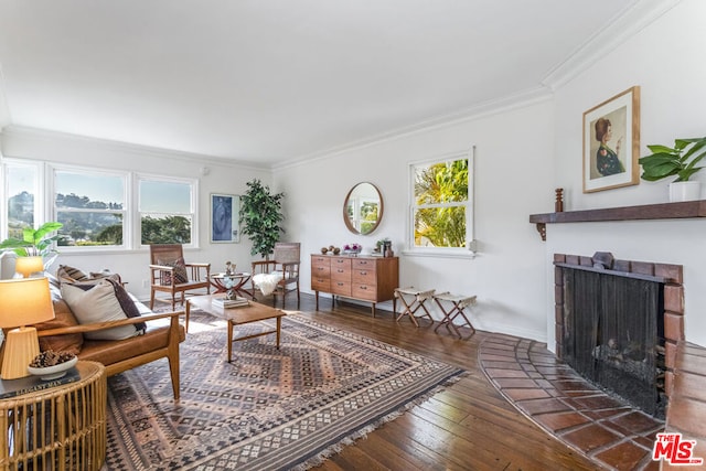 living room with ornamental molding, dark hardwood / wood-style floors, and a brick fireplace