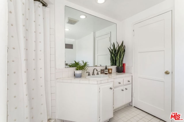 bathroom featuring tile patterned floors and vanity