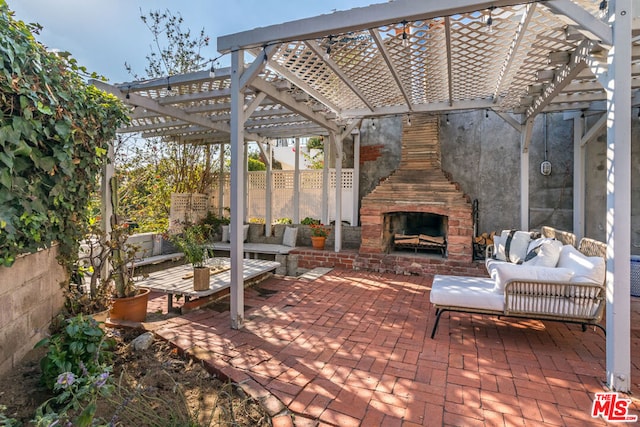 view of patio / terrace featuring a pergola and an outdoor living space with a fireplace