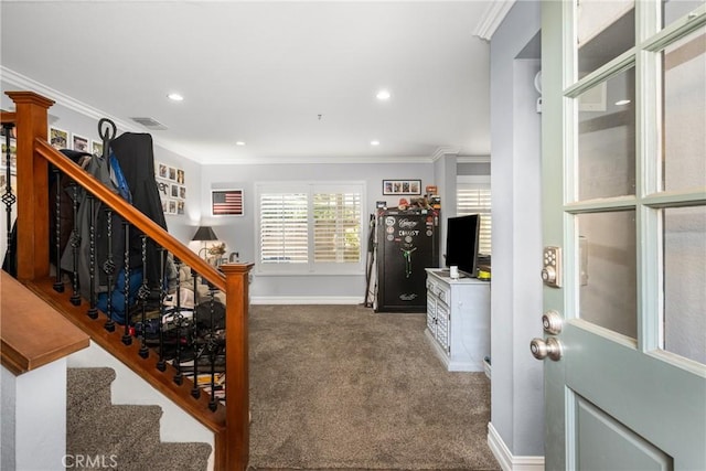 interior space with ornamental molding and carpet floors