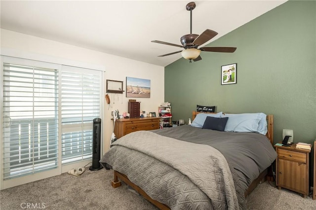 bedroom featuring lofted ceiling, light colored carpet, and ceiling fan