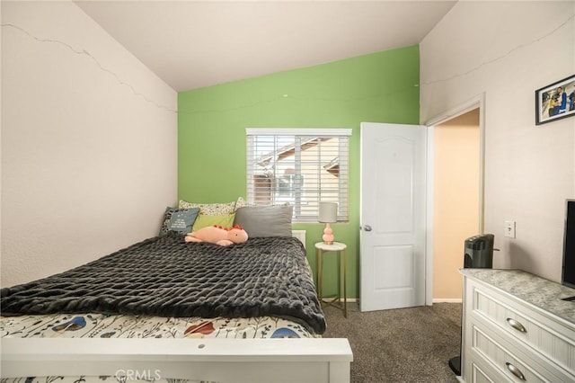 carpeted bedroom featuring lofted ceiling