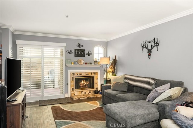 living room with hardwood / wood-style flooring and crown molding