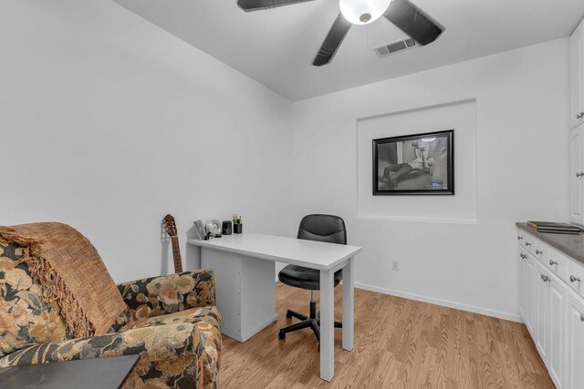 office space with ceiling fan and light wood-type flooring