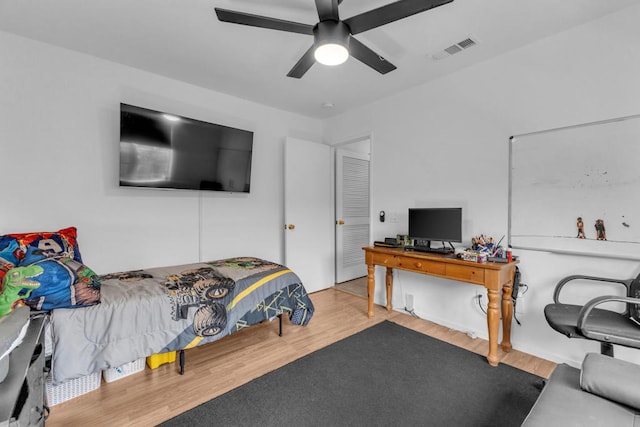 bedroom with ceiling fan and light hardwood / wood-style flooring