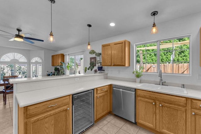 kitchen featuring wine cooler, sink, kitchen peninsula, and dishwasher