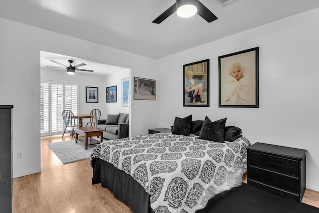 bedroom with ceiling fan and light wood-type flooring