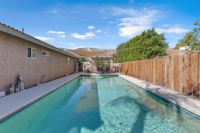 view of pool featuring a mountain view and a pergola