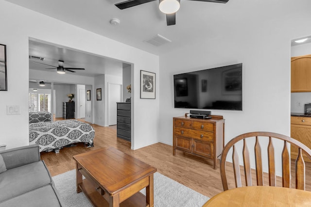 bedroom featuring ceiling fan and light hardwood / wood-style floors