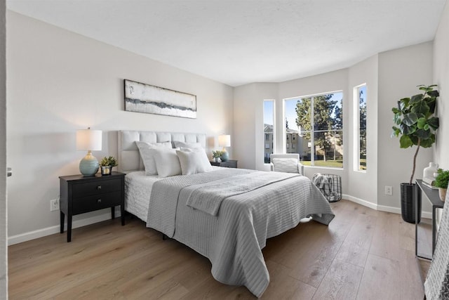 bedroom with light wood-type flooring