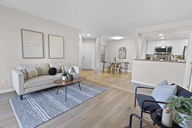 living room featuring light wood-type flooring