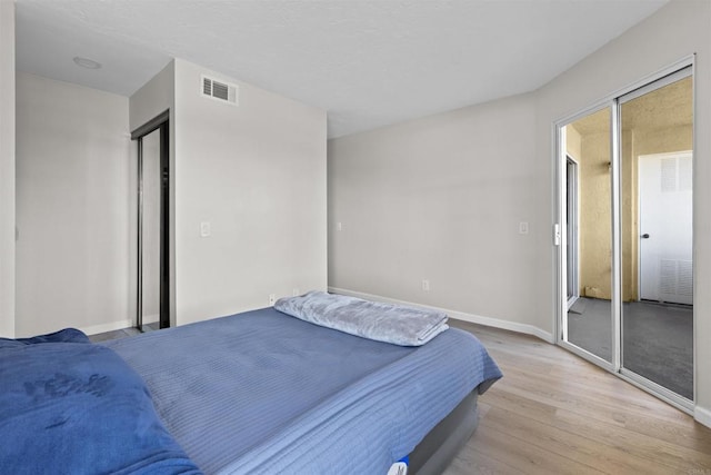 bedroom featuring light hardwood / wood-style flooring