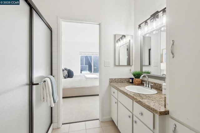 bathroom with tile patterned flooring and vanity