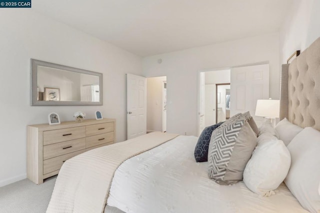 bedroom featuring light colored carpet