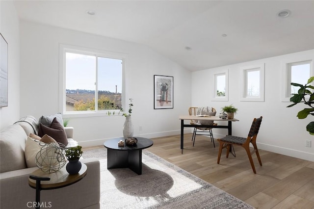 sitting room featuring light hardwood / wood-style floors and vaulted ceiling