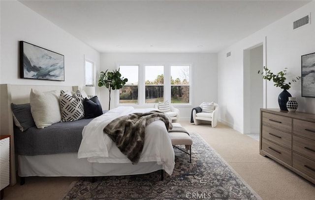 bedroom featuring light colored carpet