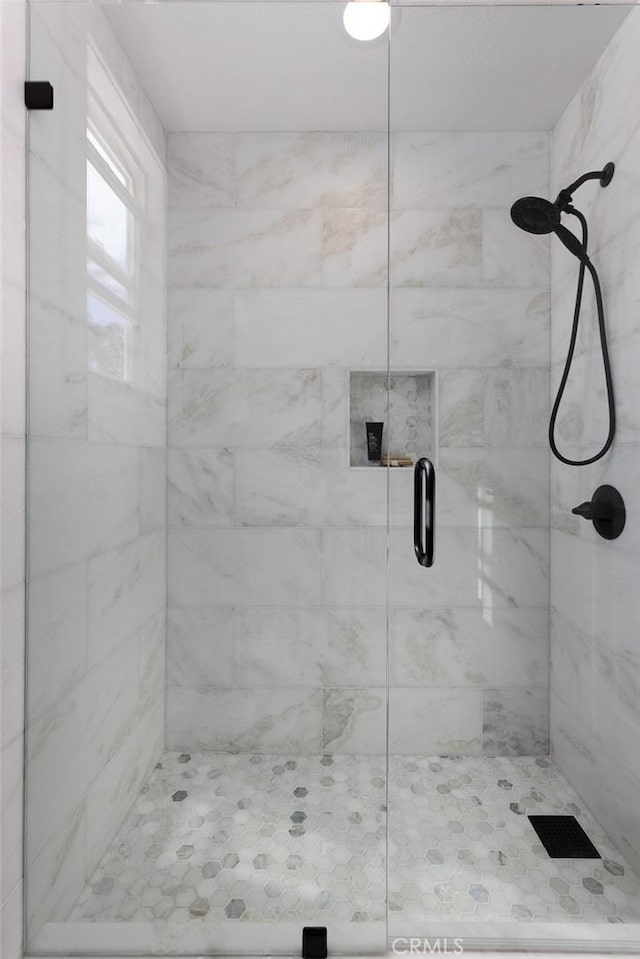 bathroom with an enclosed shower