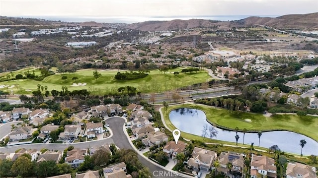 aerial view featuring a water and mountain view