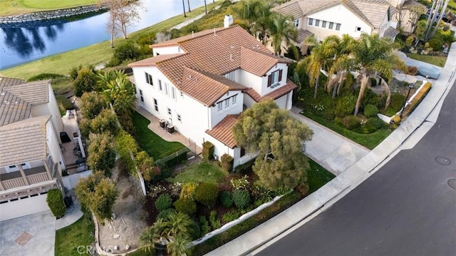 birds eye view of property featuring a water view