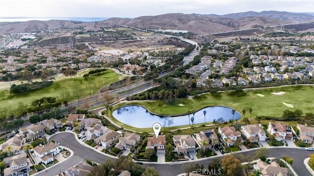 drone / aerial view featuring a water and mountain view