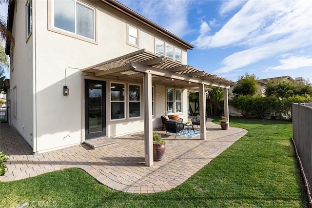 back of property with a patio area, a yard, a pergola, and an outdoor hangout area