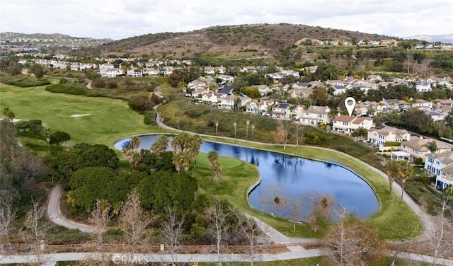 drone / aerial view featuring a water and mountain view