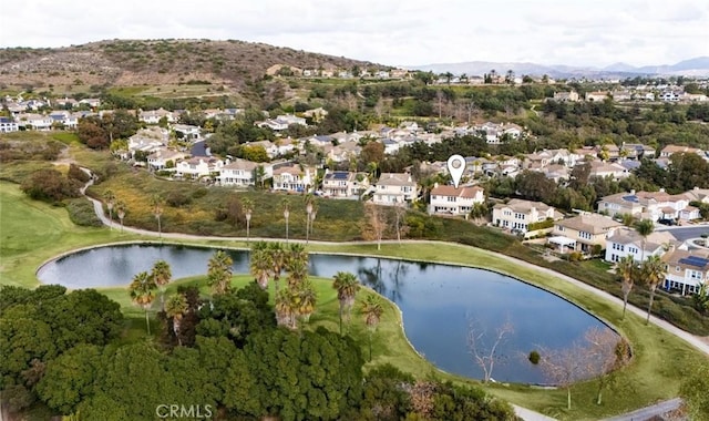 drone / aerial view featuring a water and mountain view